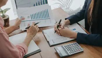 hands pointing at a graph