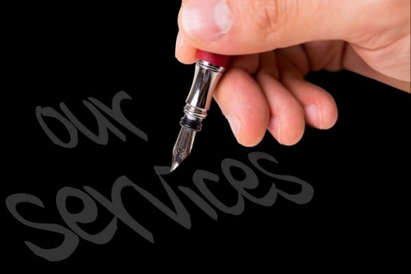 someone writing services by hand