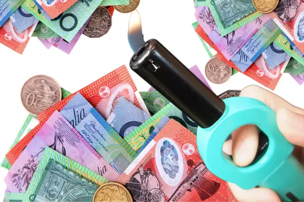 money with a lighter nearby